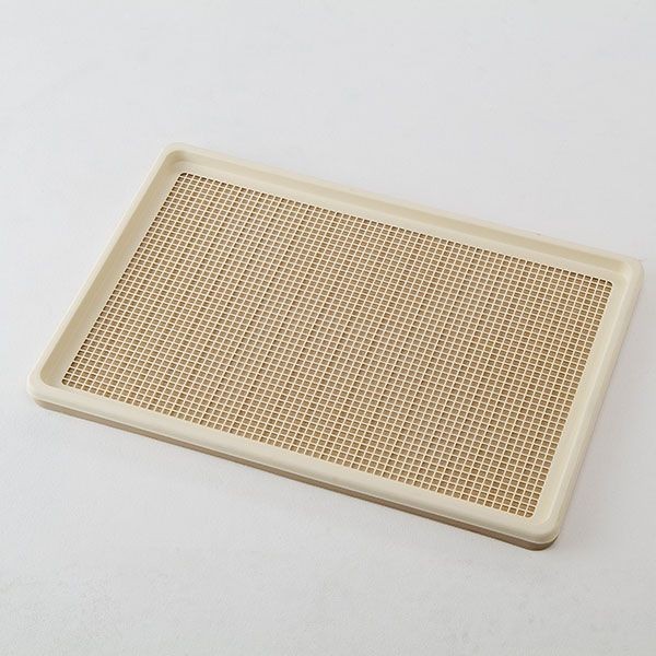 Rectangular brown grid tray with raised edges, on a white background.